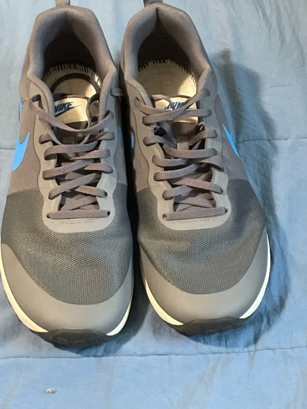 Nike Gray Sneakers with Blue Swoosh